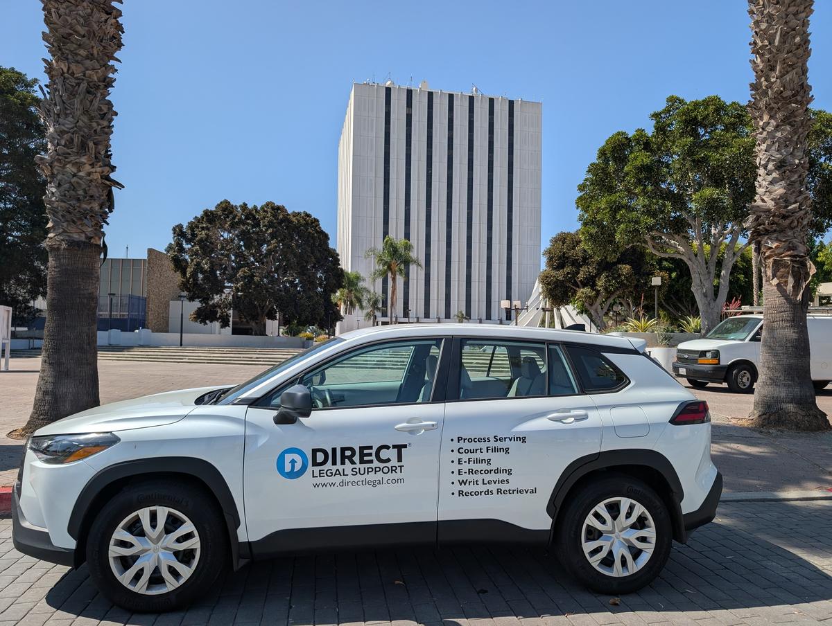 Direct Legal Support vehicle outside the Compton Courthouse on West Compton Boulevard