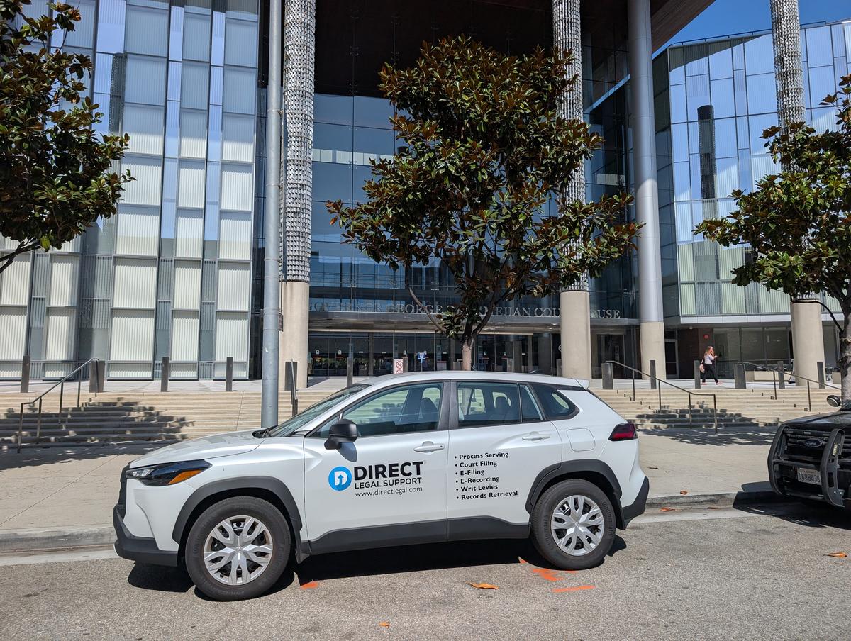 Direct Legal Support vehicle outside the Governor George Deukmejian Courthouse in Long Beach